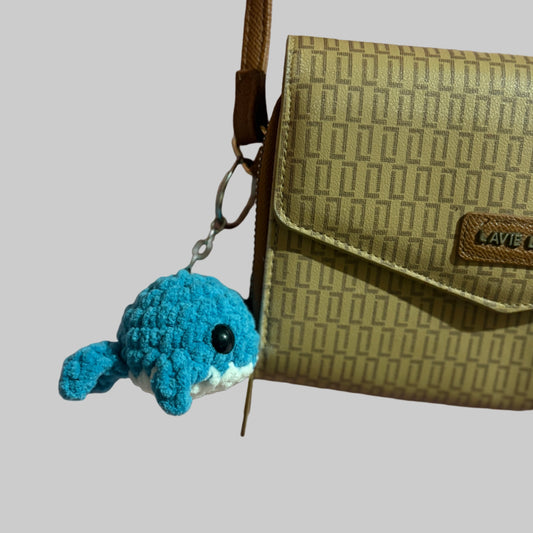 Crochet whale keychain on a bag