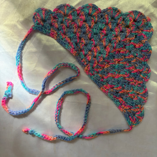 Multicolored crocheted bandana on a light background
