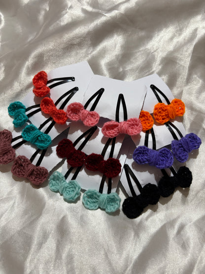 Colorful hair clips  against a white fabric background