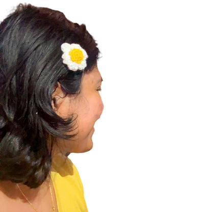 Woman with a flower in her hair looking into a cabinet