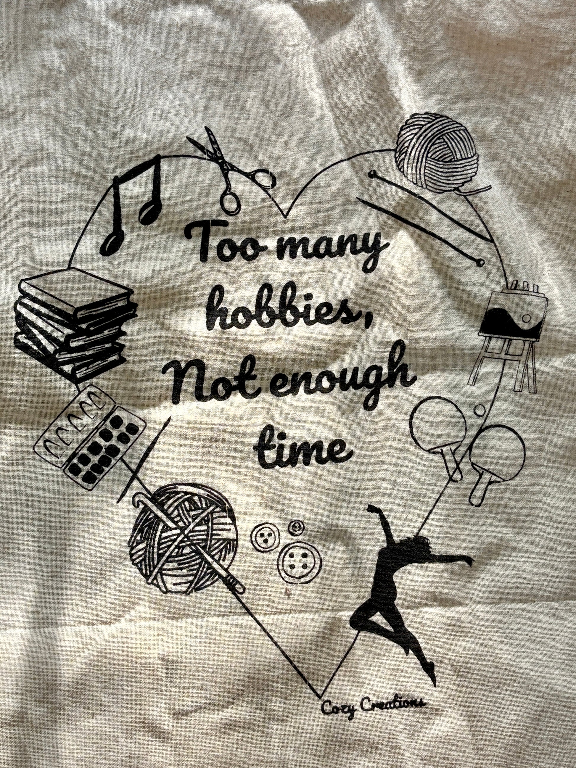 Illustration of various hobbies with text 'Too many hobbies, not enough time' on a textured background. - on a tote bag