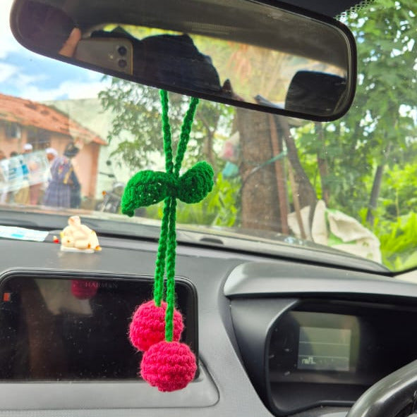 Car interior with a decorative hanging charm on the rearview mirror