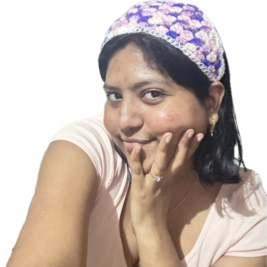 Woman wearing a floral headscarf with a plain background